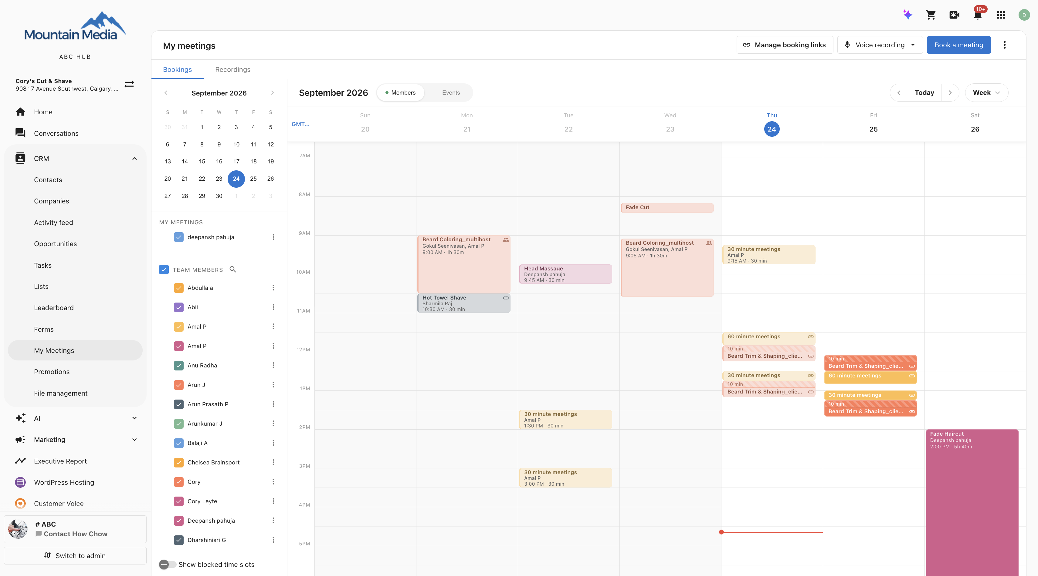 Week View with the team member filter in the sidebar and the Show blocked time slots toggle