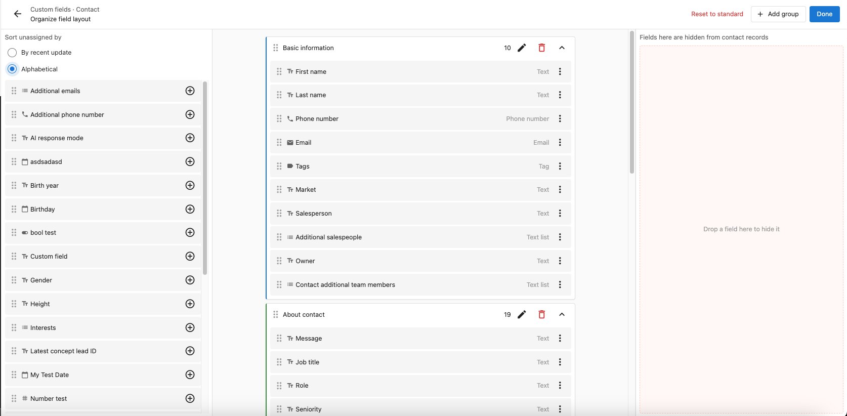 The Organize field layout editor for Contacts, with the Unassigned panel and its sort control on the left, two named field groups in the centre, and the Hidden fields panel on the right