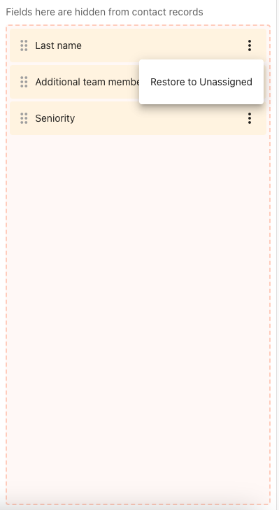 A hidden field's menu open in the Hidden fields panel, showing the Restore to Unassigned action
